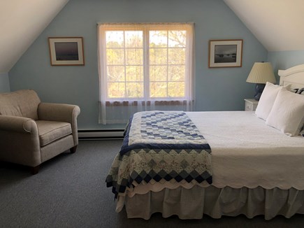 East Harwich Cape Cod vacation rental - 2nd floor guest bedroom with queen bed and comfy chair
