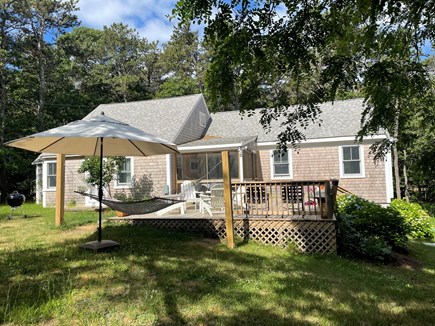 Truro Cape Cod vacation rental - Main cottage, front yard, deck and hammock.