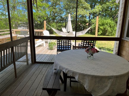 Truro Cape Cod vacation rental - Screened porch/ dining area off kitchen and deck.