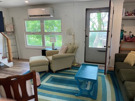 Eastham Cape Cod vacation rental - Living room with door going out to the back deck