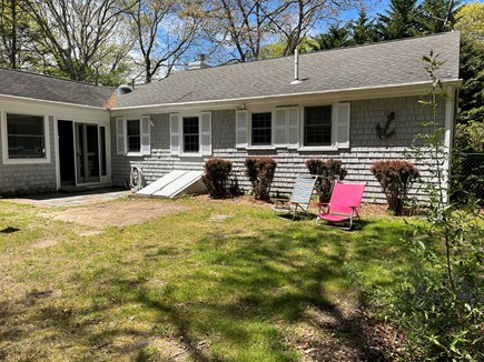 Sandwich Cape Cod vacation rental - Back of home with 1/2 acre of private fenced in yard