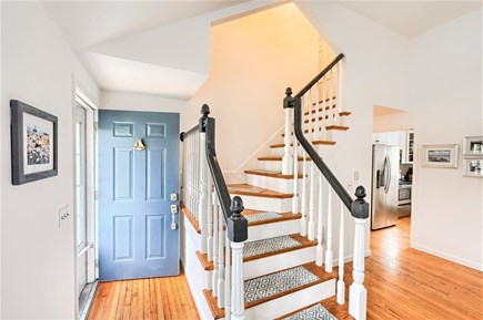 Brewster Cape Cod vacation rental - Follow the staircase to upper level which is entirely occupied by the Primary bedroom suite - 671 Great Fields Rd Brewster Cape Cod - Beach Glass - Ne