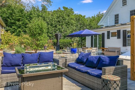 Chatham Cape Cod vacation rental - Comfy seating and a fire table.