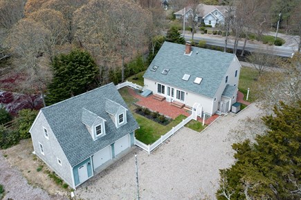 Orleans Cape Cod vacation rental - Aerial view home and garage and backyard with brick patio