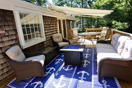 Yarmouth, Sandy Pond Escape Cape Cod vacation rental - Back deck has outdoor shower, fire pit, and retractable awning