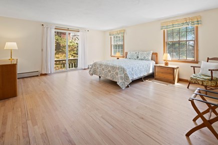 Eastham, Sunset House Cape Cod vacation rental - Master bedroom with sliding doors to the deck