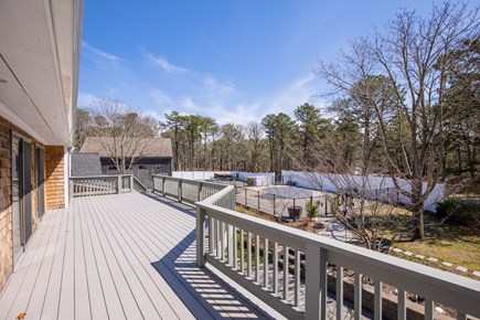 Harwich Cape Cod vacation rental - Deck overlooking the pool and rail trail!