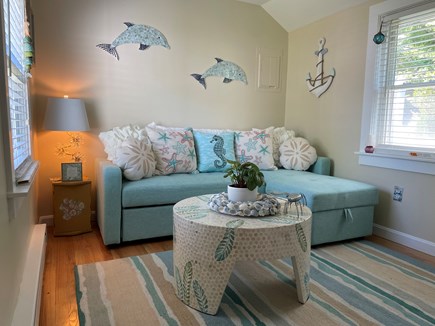 East Brewster Cape Cod vacation rental - Living room with sectional pull out couch to Queen bed.
