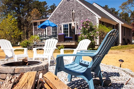 Eastham Cape Cod vacation rental - View of the deck from the fire pit.
