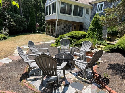 Falmouth Cape Cod vacation rental - Fire pit in backyard