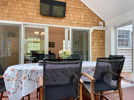 Brewster Cape Cod vacation rental - Enjoy a lovely meal on the screened-in porch.