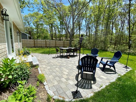 Falmouth Cape Cod vacation rental - Large patio with dining, fire pit and oversized umbrella