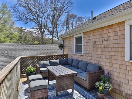 West Falmouth Cape Cod vacation rental - Relaxing deck area off 2nd-floor kitchen.