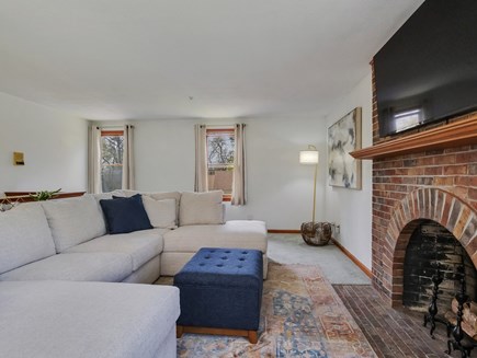 West Falmouth Cape Cod vacation rental - 2nd-floor den with smart tv, cable, and fireplace and dining.