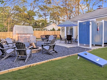 South Dennis Cape Cod vacation rental - Rear Yard with Outdoor Shower, Patio, and Fire Pit