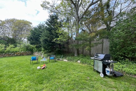 Hyannis Cape Cod vacation rental - Cook on the gas grill, relax in the backyard located off kitchen