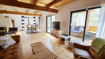 Wellfleet Cape Cod vacation rental - Living room opens to dining area with sliders to deck