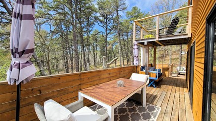 Wellfleet Cape Cod vacation rental - Lovely deck with dining table, swing and another seating area