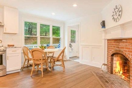Sandwich Cape Cod vacation rental - Small kitchen table near fire place for casual dining