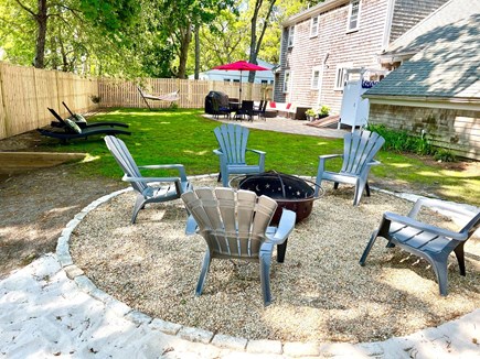 West Yarmouth Cape Cod vacation rental - Fire pit area with adjacent sand beach and kids corner