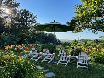 Truro Cape Cod vacation rental - Back garden sitting area with views of Pamet River and the bay.