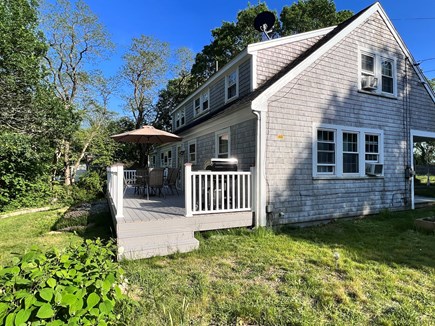 Eastham Cape Cod vacation rental - Back deck with gas grill and dining table