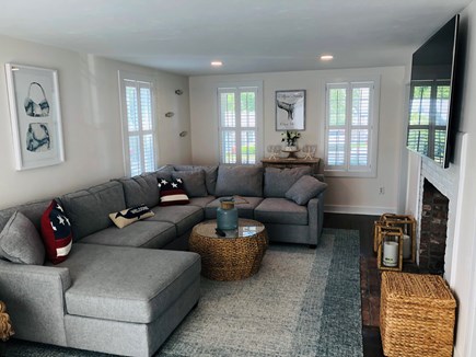 West Yarmouth Cape Cod vacation rental - Open living room with sectional sofa and 75 Inch TV