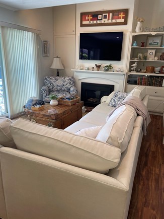 Brewster  Cape Cod vacation rental - Living room area with fireplace and cable television.