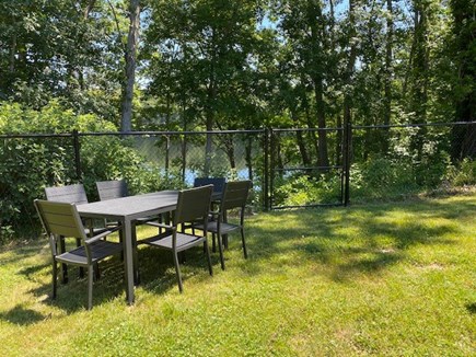 East Falmouth Cape Cod vacation rental - Patio table looking out at Round Pond