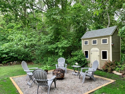 Brewster Cape Cod vacation rental - Yard off of side deck with fire pit