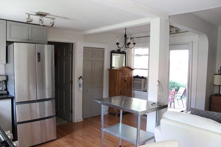 Provincetown Cape Cod vacation rental - Refrigerator, bathroom, washer/dryer and entrance area.A/C unit