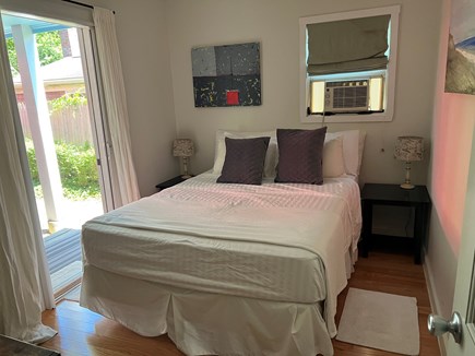Provincetown Cape Cod vacation rental - Queen bed with window air conditioning and separate entrance.