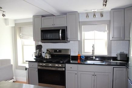 Provincetown Cape Cod vacation rental - Kitchen with stove, microwave