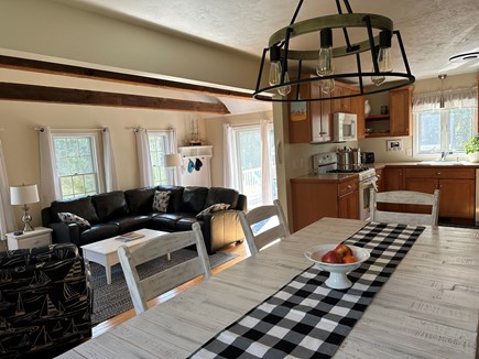 Brewster Cape Cod vacation rental - Open concept kitchen and dining room with large farmer's table.