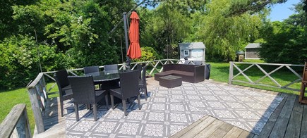 Yarmouth Cape Cod vacation rental - Private patio, with table for 8, sun umbrella and love seat.