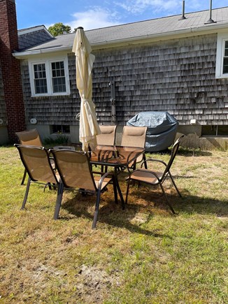 Harwich Cape Cod vacation rental - Backyard with grill and outdoor seating