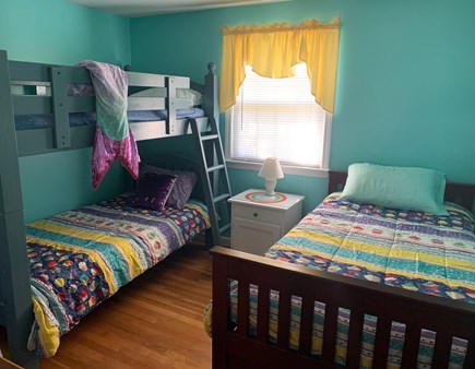 Dennis Cape Cod vacation rental - Bunk Room, closet and underbed storage. Portable crib in closet.