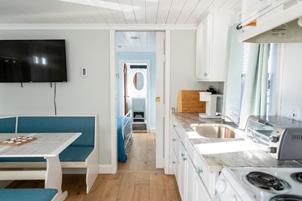 Yarmouth Cape Cod vacation rental - Dining area, kitchenette and entrance to full bedroom.