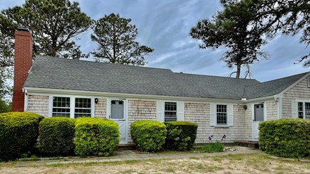 Dennis Port Cape Cod vacation rental - Street view of our cottage. Parking out front for 2 cars/unit