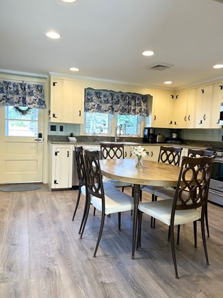 Dennis Port Cape Cod vacation rental - Newly painted kitchen (door leads to patio w/ table & grill)