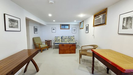 Truro Cape Cod vacation rental - Lower level den with seating and TV