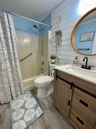 Centerville Cape Cod vacation rental - Family bathroom with a bath tub with grab bars