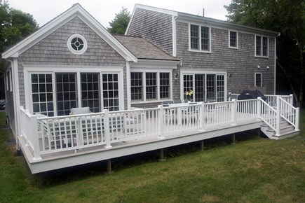 Dennis Village Cape Cod vacation rental - Back Yard Deck & Yard suitable for entertaining and Lawn Games.
