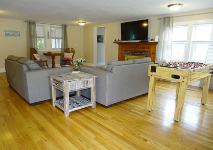 Dennis Port Cape Cod vacation rental - Large living room with two couches, smart TV, and foosball table