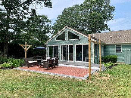 Harwich Cape Cod vacation rental - Fenced yard w/ two patios to play/rest and an outdoor shower.