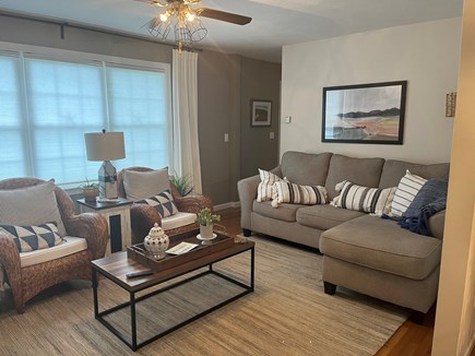 Falmouth Cape Cod vacation rental - Living room with cozy seating, sofa and 2 chairs with TV