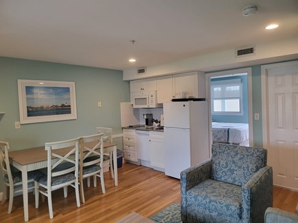 Dennis Port Cape Cod vacation rental - Kitchen with stove, microwave, fridge, dining table