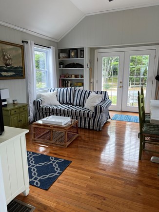Hyannis Cape Cod vacation rental - 2nd Family Room with some water views, tv and opens to patio