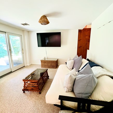Mashpee Cape Cod vacation rental - Family Room with TV on bottom basement floor.