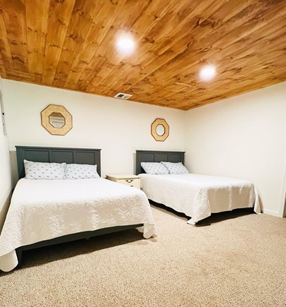 Mashpee Cape Cod vacation rental - Basement bedroom with two fulls. Basement is a walk out basement.